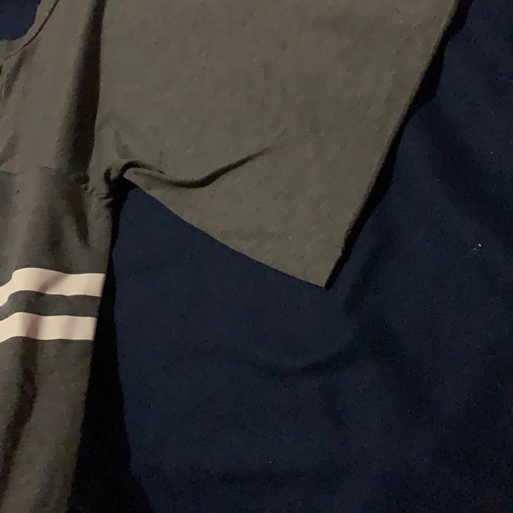Grey cropped top with white strips on sleeves